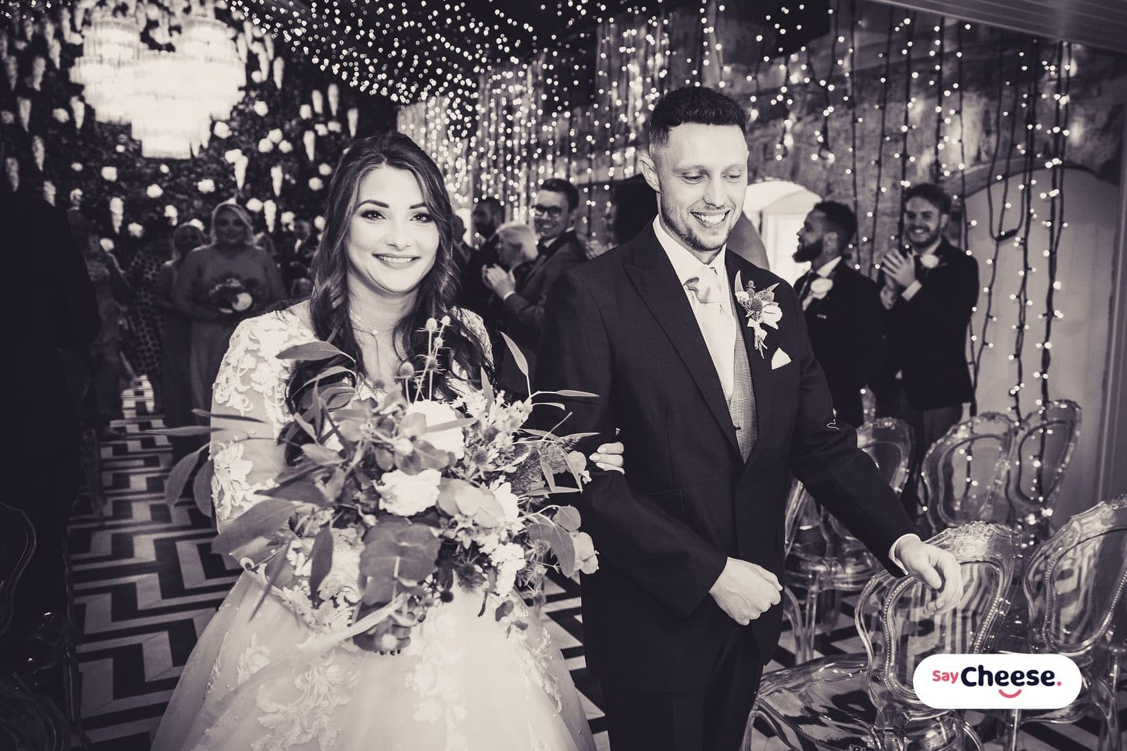 A newly married couple celebrating with their guests